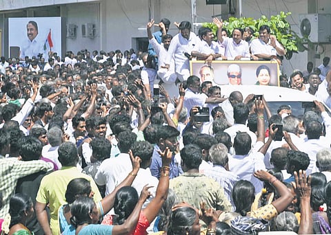 Senior AIADMK leader and Gobichettipalayam MLA K A Sengottaiyan surrounded by party cadre and supporters in Erode on Friday.