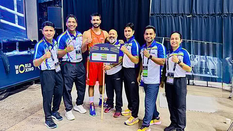 India's Lakshya Chahar with the coaches and support staff after his win on Sunday