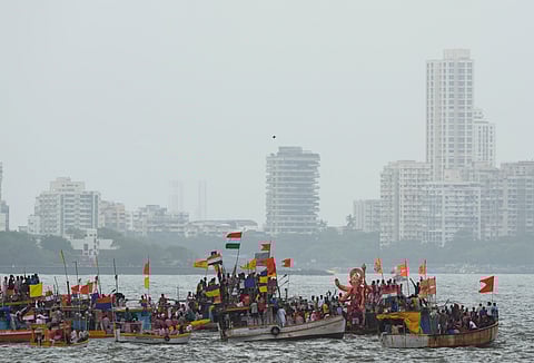 eople on boats take part in procession of 'Lalbaugcha Raja' idol of Lord Ganesha before visarjan, immersion, during the 'Ganesh Chaturthi' festival, at Girgaum Chowpatty, in Mumbai, Sunday, Sept. 7, 2025.