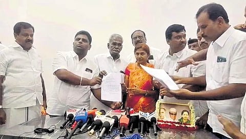 Former MP V Sathyabhama receiving resignation letters from party functionaries in Erode. She was sacked from party posts later in the day
