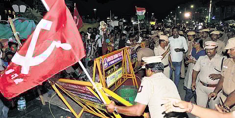 Police personnel clearing the protest site outside Ripon Building.