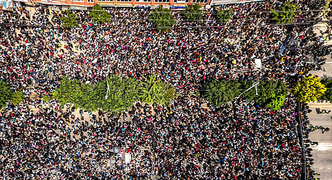 An aerial view shows demonstrators gathered outside Nepal's Parliament during a protest in Kathmandu on September 8, 2025, condemning social media prohibitions and corruption by the government.