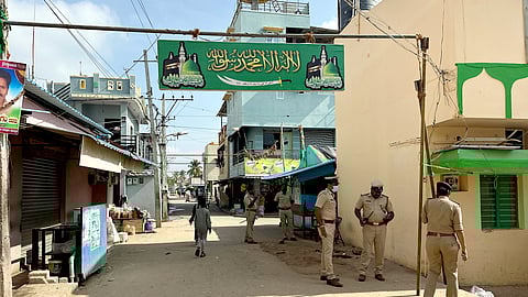 Police personnel patrol an area as security heightens following clashes during the immersion of Lord Ganesh idols, in Maddur, Karnataka, Tuesday, Sept. 9, 2025.