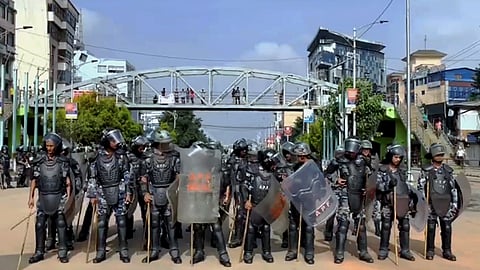 Security personnel with shields stand guard during a protest by youth against the Nepal government's decision to ban social media sites, in Kathmandu, Nepal, Tuesday, Sept. 9, 2025.