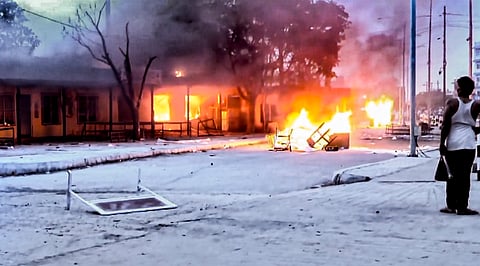 Smoke and flames billow out after a property and several structures were set on fire by agitators in the wake of anti-government protests in Nepal, near the India-Nepal border. (Photo | PTI)