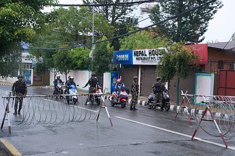 Nepalese army personnel check and question civilians at a checkpoint in Kathmandu, Nepal, Wednesday, Sept. 10, 2025.