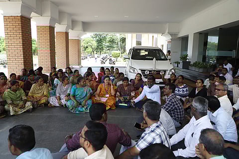 Associate professors staging a sit-in protest in front of the Vice-Chancellor's (VC) office on the campus in Coimbatore on Thursday.