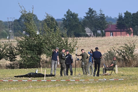 Police and Military Police secure parts of a damaged UAV shot down by Polish authorities at a site in Wohyn, Poland, Wednesday, Sept. 10, 2025.