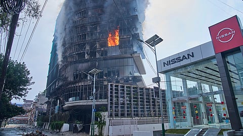Flames rise from Hilton hotel after it was set on fire in Kathmandu, Nepal, Wednesday, Sept.10, 2025.