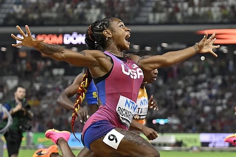 Sha’Carri Richardson of the United States celebrates as she crosses the line to win gold in the women's 100 meter final during the World Athletics Championships in Budapest, Hungary, Monday, Aug 21, 2023