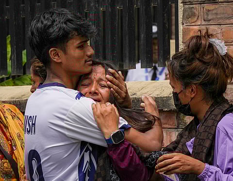 Grieving family members of 23-year-old Roshan Neupane, who lost his life during the recent protests in Nepal, gather at the Teaching Hospital, Kathmandu.