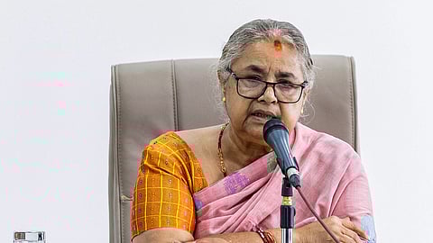 Newly elected Prime Minister of Nepal's interim government Sushila Karki speaks with officials at the prime minister's office in Kathmandu on September 14, 2025.