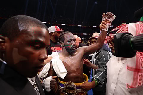 Dana White awards the belt to Terence Crawford after Crawford won by unanimous decision against Canelo Alvarez (not pictured) in their undisputed super middleweight title fight on September 13, 2025 in Las Vegas, Nevada.