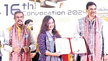 Governor Hari Babu Kambhampati along with Union minister Dharmendra Pradhan awarding degree to a student