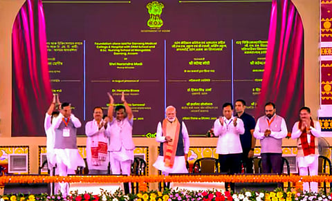 In this screengrab from a video posted on Sept. 14, 2025, Prime Minister Narendra Modi with Union Minister Sarbananda Sonowal and Assam Chief Minister Himanta Biswa Sarma during laying of foundation stone and inauguration of developmental works, in Darrang, Assam.