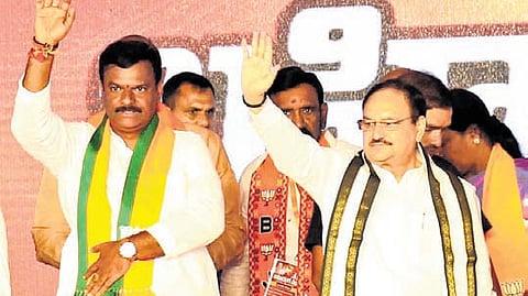 BJP national president JP Nadda and party’s AP unit chief PVN Madhav waving to the crowd at the ‘Saradhyam’ public meeting in Vizag on Sunday.