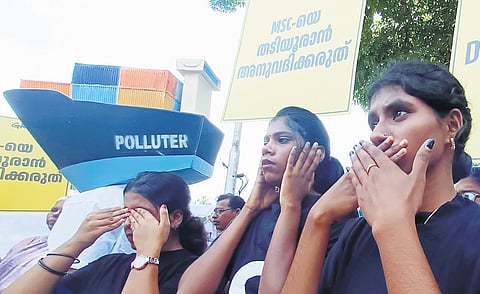 Greenpeace activists protest against the delay in ensuring justice to the coastal community affected by ship wreckage, in front of Secretariat on Tuesdsay