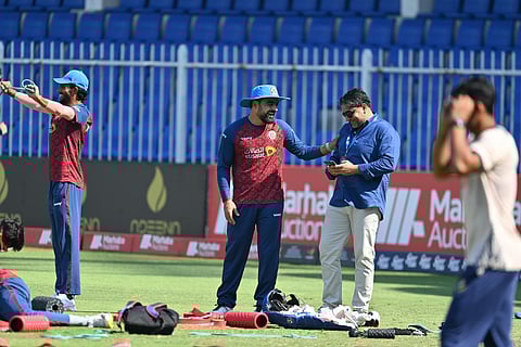 Commentator Ahmad Farhad Fidai (L) with Afghanistan captain Rashid Khan
