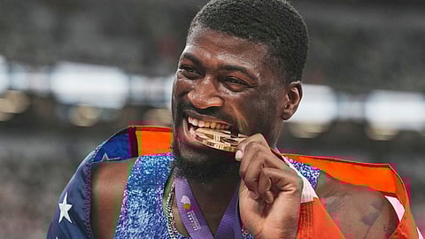 United States' Cordell Tinch celebrates after winning gold medal in men's 110 meters hurdles final at the World Athletics Championships in Tokyo, Tuesday, Sept. 16, 2025.
