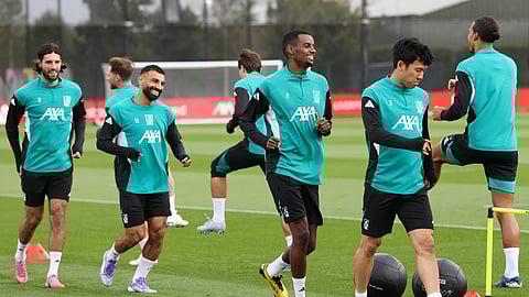Liverpool's Dominik Szoboszlai (L), Mohamed Salah (2L), Alexander Isak (C) and Japanese midfielder Wataru Endo attends a training session at the team's training ground in Kirkby.