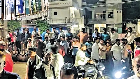 Curious onlookers outside the SBI branch at Chadchan town in Vijayapura district.