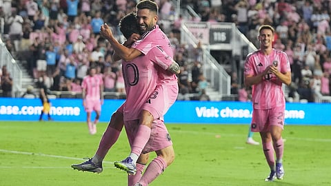 Inter Miami forward Lionel Messi, left, celebrates with defender Jordi Alba, right, after scoring a goal during the first half of an MLS soccer match against Seattle Sounders, Tuesday, Sept. 16, 2025, in Fort Lauderdale, Fla.