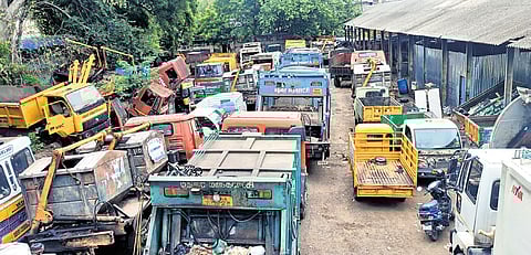 Vehicles parked at Sellur shed on Wednesday due to the protest by sanitation workers who accused the contractor of ill-treating them.