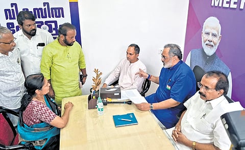 BJP state president Rajeev Chandrasekhar and Union minister George Kurian receiving a petition at the ‘Meet the Leader’ helpdesk at its headquarters in Thiruvananthapuram on Wednesday