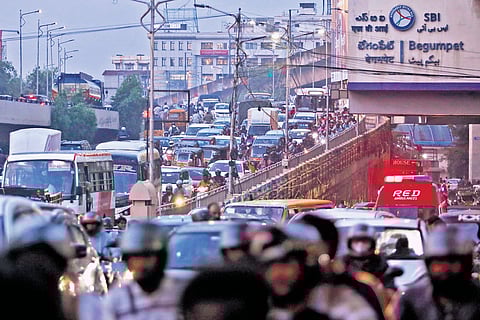 Vehicular movement crawls near the Begumpet Metro station following the heavy rains that lashed Hyderabad on Thursday.