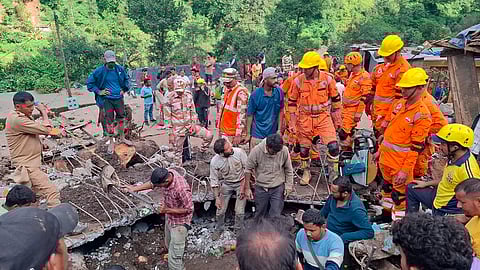 NDRF personnel and others at work during a search and rescue operation after landslides and flooding triggered by heavy rainfall, in Chamoli district, Uttarakhand.
