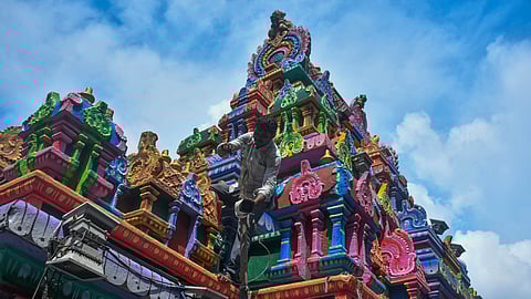 Workers setting up CC cameras at the Kanaka Durga temple premises ahead of Dussehra festivities atop Indrakeladri hill in Vijayawada on Wednesday.