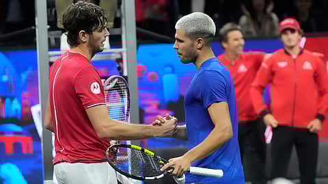Team World's Taylor Fritz, of the United States, left, is congratulated by Team Europe's Carlos Alcaraz, of Spain, after Fritz defeated Alcaraz in their match during the second day of the Laver Cup tennis tournament in San Francisco, Saturday, Sept. 20, 2025.