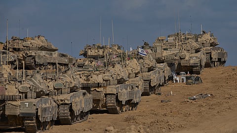 Israeli tanks at a staging area near the border with the Gaza Strip, in southern Israel, Sunday, Sept. 21, 2025.