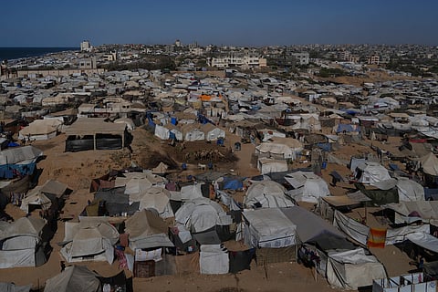 A makeshift tent camp for displaced Palestinians stretches across an area in Zawaida, in the central Gaza Strip, Saturday, Sept. 20, 2025.