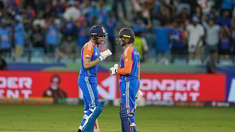 India's Shubman Gill, left, and his batting partner Abhishek Sharma talks during the Asia Cup cricket match between India and Pakistan at Dubai International Cricket Stadium in Dubai, United Arab Emirates, Sunday, Sept. 21, 2025.