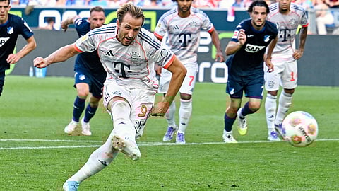 Bayern's Harry Kane scores their side's third goal of the game from a penalty during the German Bundesliga soccer match between Hoffenheim and Bayern Munich at the PreZero Arena in Sinsheim, Germany, Saturday Sept. 20, 2025.