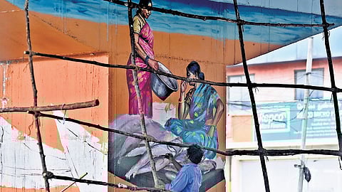 An artist painting a mural beneath the Koyambedu flyover as part of beautification drive by the Greater Chennai Corporation.
