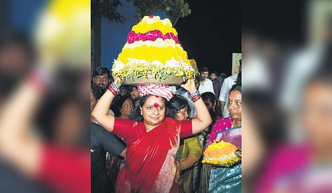 Telangana Jagruthi President K Kavitha arrives with a Bathukamma at Chintamadaka, the native village of BRS president K Chandrasekhar Rao, in Siddipet district on Sunday.