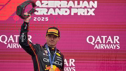 Red Bull driver Max Verstappen of the Netherlands stands on the pdium after winning the Azerbaijan Formula One Grand Prix in Baku, Azerbaijan, Sunday, Sept. 21, 2025.
