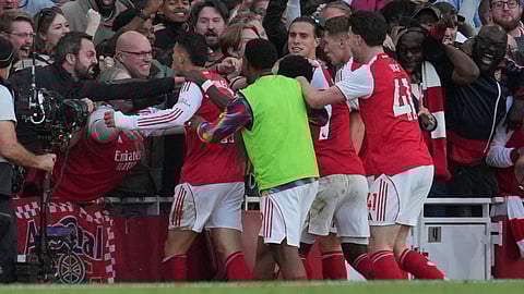 Aresenal players celebrate after a goal during the Premier League soccer match between Arsenal and Manchester City in London, Sunday, Sept. 21, 2025.