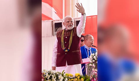 Prime Minister Narendra Modi waves to the gathering during the foundation stone laying and inauguration of various development projects at a rally, in Itanagar, Arunachal Pradesh.