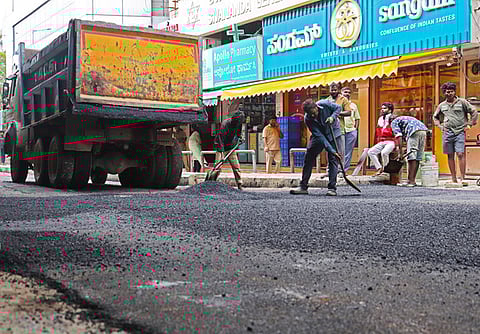 A damaged road with potholes inconveniencing commuters repaired by GBA at Hare Krishna Road on Monday afternoon.