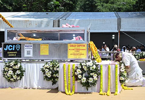 Assam Chief Minister Himanta Biswa Sarma pays his last respects to singer Zubeen Garg during his funeral, on the outskirts of Guwahati.