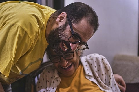 Pro-democracy Egyptian-British activist Alaa Abd el-Fattah, who was in prison for almost all of the past 12 years, hugs his mother Laila Soueif, as he arrives at his home, after a presidential pardon, in Cairo, Egypt, Tuesday, Sept 23, 2025.