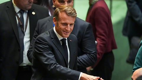 French President Emmanuel Macron greets delegates upon arriving inside the United Nations General Assembly Hall, Monday, Sept. 22, 2025, at UN.. headquarters.