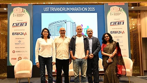 Milind Soman unveiling the T-shirt of UST Trivandrum Marathon 2025.
