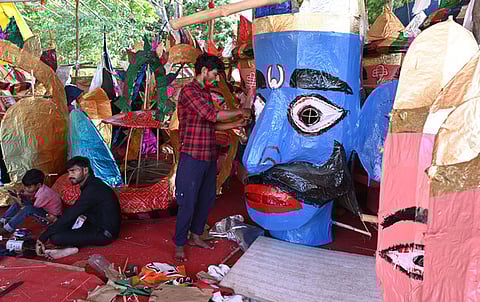 Artists working on the effigy of the Hindu demon king Ravana at the Ramlila ground in New Delhi on September 24, 2025.