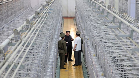 This undated photo provided on Sept. 13, 2024, by the North Korean government shows its leader Kim Jong Un, center, on an inspecting visit at what they say is an institute of nuclear weapons and a facility for nuclear materials at an undisclosed location in North Korea.