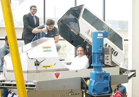 Minister Sridhar Babu in a fighter jet cockpit simulator, with T-Works CEO Joginder Tanikella.