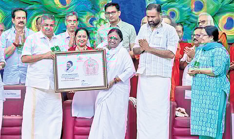 Cultural Affairs Minister Saji Cherian presenting the state government’s honour to Mata Amritanandamayi. Actor Devan, N Prasanth (IAS), MLAs C R Mahesh, Uma Thomas and The New Indian Express CEO Lakshmi Menon are also seen